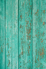 Fototapeta na wymiar rough green painted wooden fence. old grunge board background