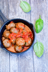 Tasty home made    italian  dish mini  meatballs baked in marinara tomato  sauce