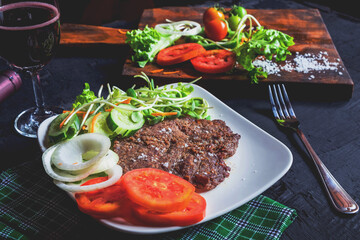 Grilled steak and red wine on the table