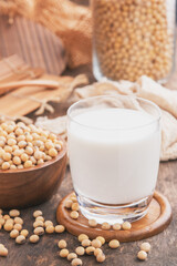 Soy milk.Soy milk on wooden background.Soy milk and soy bean on wooden background