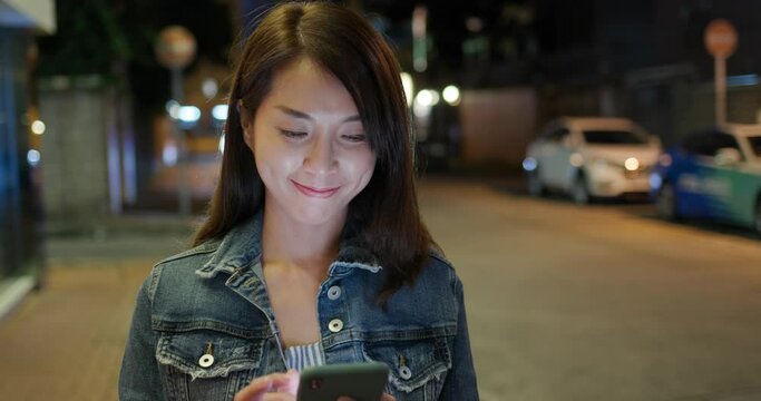 Asian woman use of mobile phone at outdoor