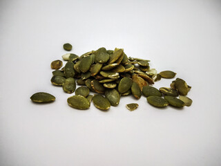 pumpkin seed close up shot in a white background
