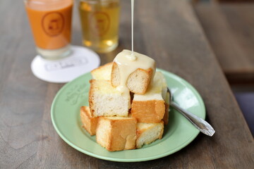Dish of delicious thai dessert - Fried bread with sweetened condensed milk