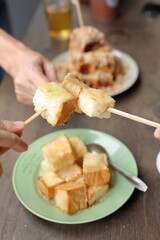 Dish of delicious thai dessert - Fried bread with sweetened condensed milk