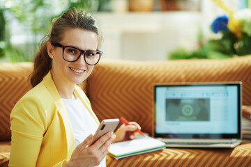 happy young woman with laptop and smartphone study online