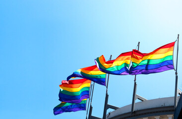 Happy Pride with pride flags waving