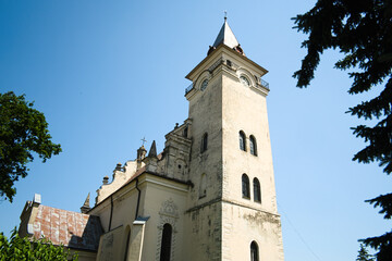 Fototapeta na wymiar Exterior of old catholic church of Saint Nicolas in Rogatin town. Ivano-Frankivsk region, Ukraine