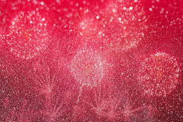 Red glitter bokeh texture with firework abstract background.