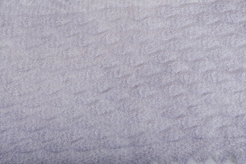 Fototapeta na wymiar top view closeup handmade openwork binding grey, knitted, woolen scarf with pattern