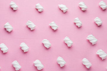 Marshmallows on a pink background
Soft pink color mini marshmallows dessert top view, flat lay style.