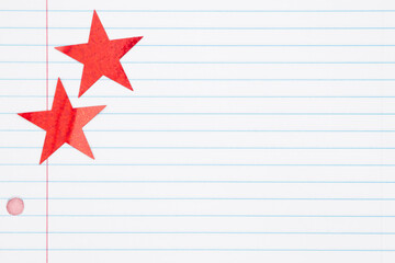 Fototapeta na wymiar School background with two red stars on lined paper