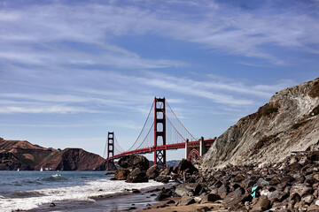 Panoramic view of famous Golden Gate from the beach on a sunny day of summer in San Francisco, California.