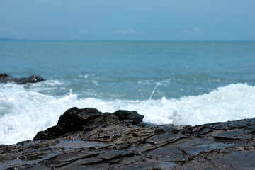 Wave crashing on the rocky reef