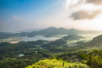 Fototapeta premium View of Ganghwado Island mountains from Goryeosan mountain Jeokseoksa temple in Incheon, Korea