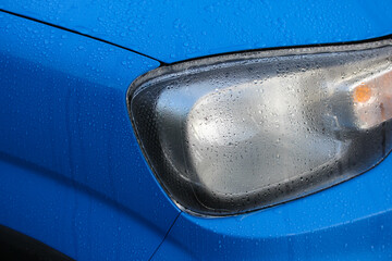 Close up of blue car with dew drops