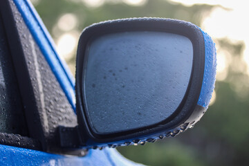 Car rear view mirror with morning dew 