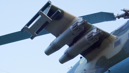 Guns and machine guns on a military helicopter. Fire arsenal of assault helicopter.