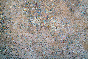 Small multi-colored pebbles in the form of a fence