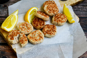 Home made oven baked chicken  meatballs , chily peppers and fresh basil on  rustic background. Diet food.