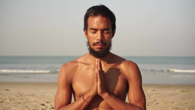 Portrait of a yogi. A man practices yoga and methidation in nature.