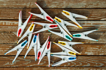 colored clothespins on a wooden table