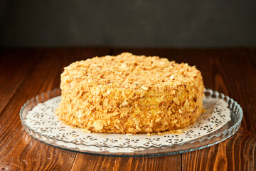 Traditional fresh dessert Napoleon cake on wooden background