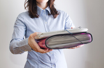 hands of business woman delivering a lot of documentation