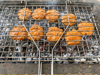 Delicious Grilled meat on barbecue - Meat on the mangal in nature. Picnic.