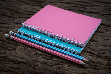 Pencil and book mockup on the old wood desk at the background, Flat lay photo