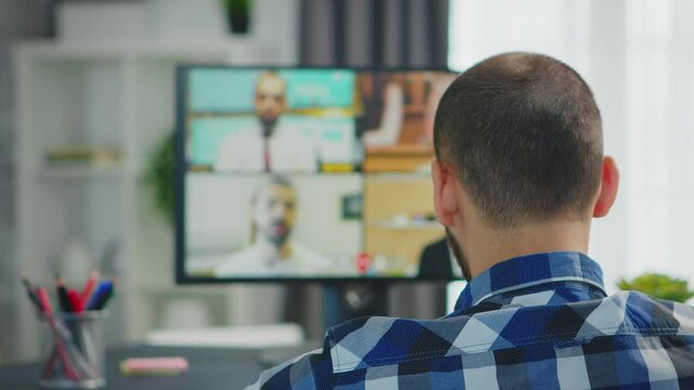 Entrepreneur in wheelchair chatting with coworkers on video conference. Handicapped invalid paralysed freelancer, immobilized entrepreneur working from home, ilness and disability
