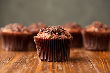 Traditional fresh dessert chocolate muffin on wooden background