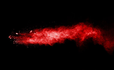 Fototapeta na wymiar Launched red powder on white background.