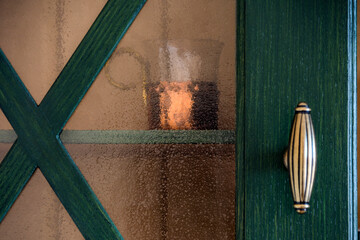 Kitchen: glass in copper cup holder in dresser