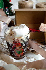 cup of christmas coffee with marshmallows on the table