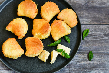Fresh baked home made  Mini cheese puff pastries.Cheese pie with phyllo pastry and herbs