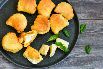Fresh baked home made  Mini cheese puff pastries.Cheese pie with phyllo pastry and herbs