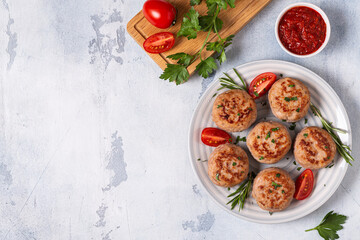 Fresh chicken cutlets with tomatoes and rosemary