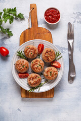 Fresh chicken cutlets with tomatoes and rosemary