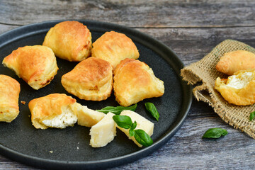 Fresh baked home made  Mini cheese puff pastries.Cheese pie with phyllo pastry and herbs