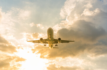 Landscape of sunset with Plane from Phuket at Nai Yang Beach Phuket Province, Thailand.