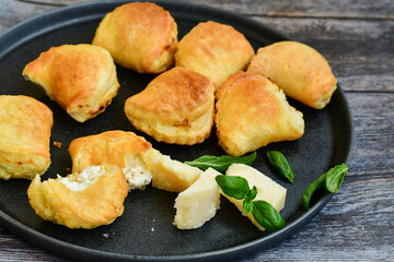 Fresh baked home made  Mini cheese puff pastries.Cheese pie with phyllo pastry and herbs