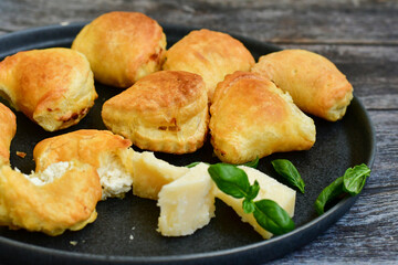 Fresh baked home made  Mini cheese puff pastries.Cheese pie with phyllo pastry and herbs