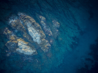 Rocky island in the sea from a bird's-eye view