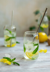 refreshing cocktails with lemon and mint in glasses