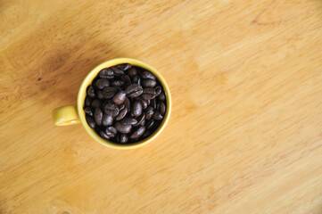 Fototapeta na wymiar Cup full of coffee beans