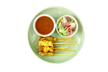 Fototapeta na wymiar moo satay with peanut dipping sauce and cucumber onions in vinegar, thai food delicious