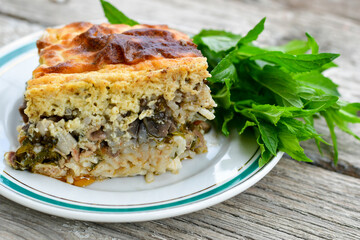 piece of meat pie with  rice and vegetables