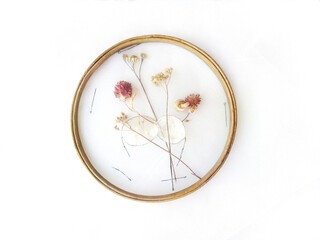 Handmade Embroidery with Dried Flowers and withered herbs on mesh fabric, grid, tulle, round hoop on background. Home Decor, interior, walls. Step-by-step masterclass, handicraft guide, top view © PickOk Studio 