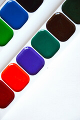 watercolors. bright colors on a white background. accessories for artists, creativity.