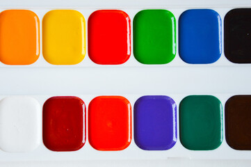 watercolors. bright colors on a white background. accessories for artists, creativity.